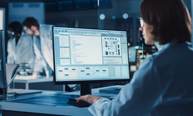 Medical coders using AI tools to improve coding accuracy in clinical trials.