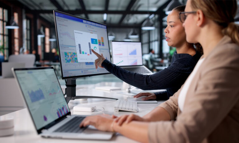 Clinical trial team analyzing integrated eClinical workflow dashboards