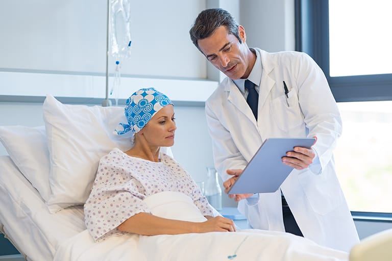 Oncology clinical trial participant reviewing study information during a multi-site data capture workflow supported by Clinion EDC