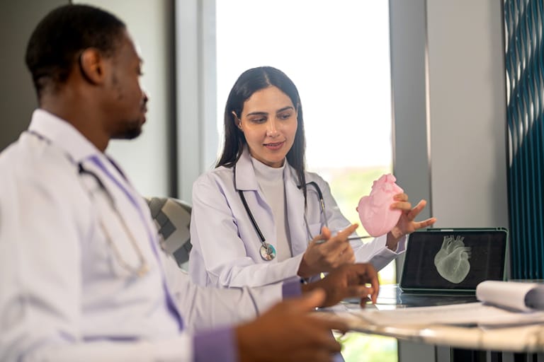 Clinical research team reviewing cardiac imaging for a 90-site Phase IV cardiology study supported by Clinion EDC